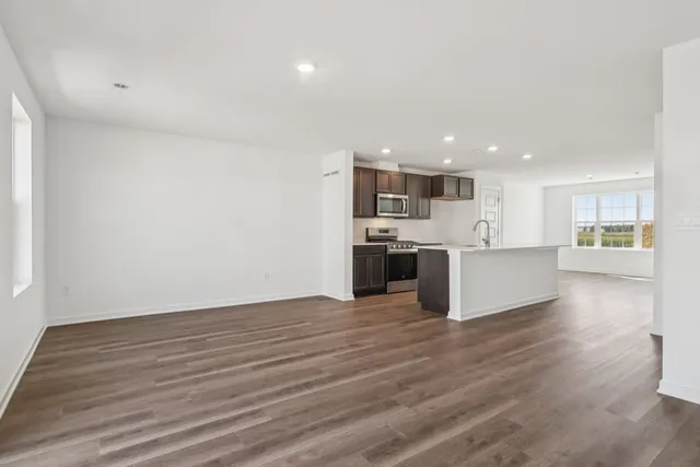a view of kitchen view wooden floor and window
