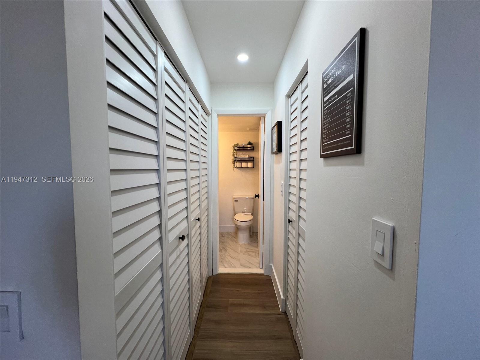 8425 Northwest 8th Street, Unit 406 Miami, FL 33126 - Photo 13 of 22 a view of a hallway