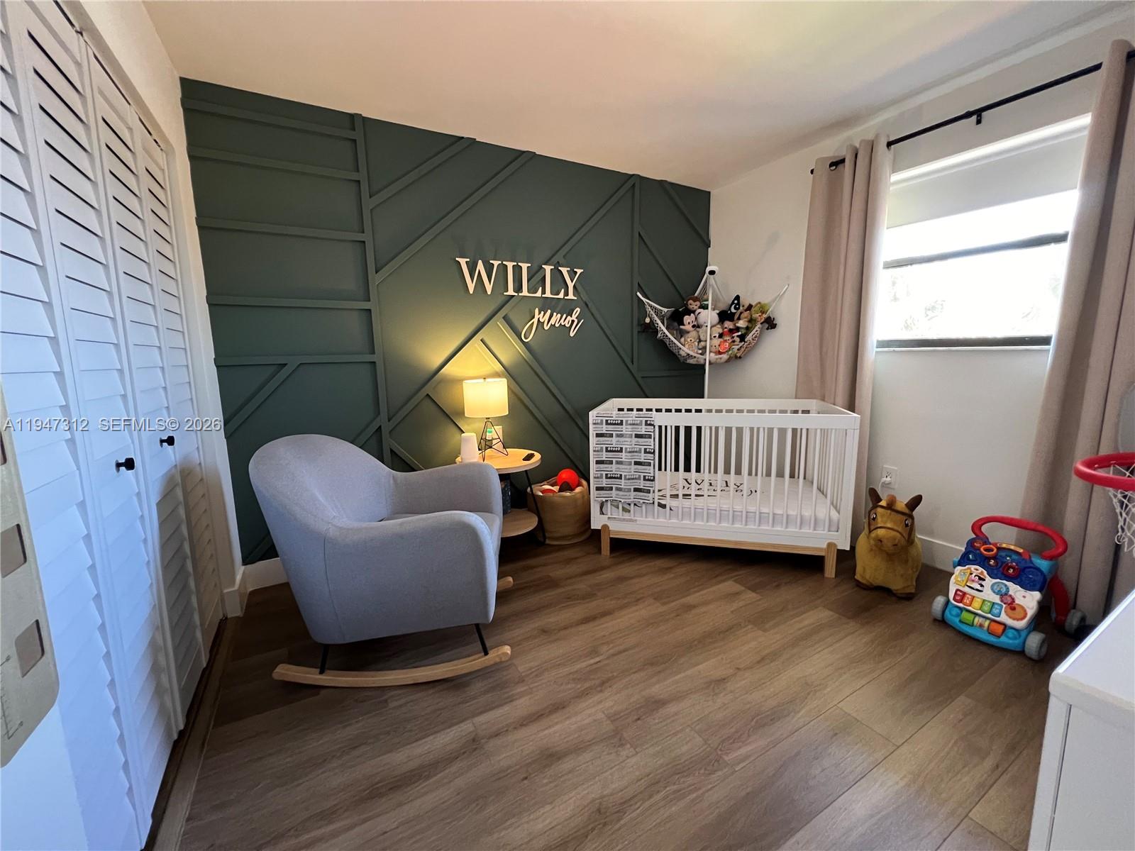 8425 Northwest 8th Street, Unit 406 Miami, FL 33126 - Photo 15 of 22 a living room with furniture and a window