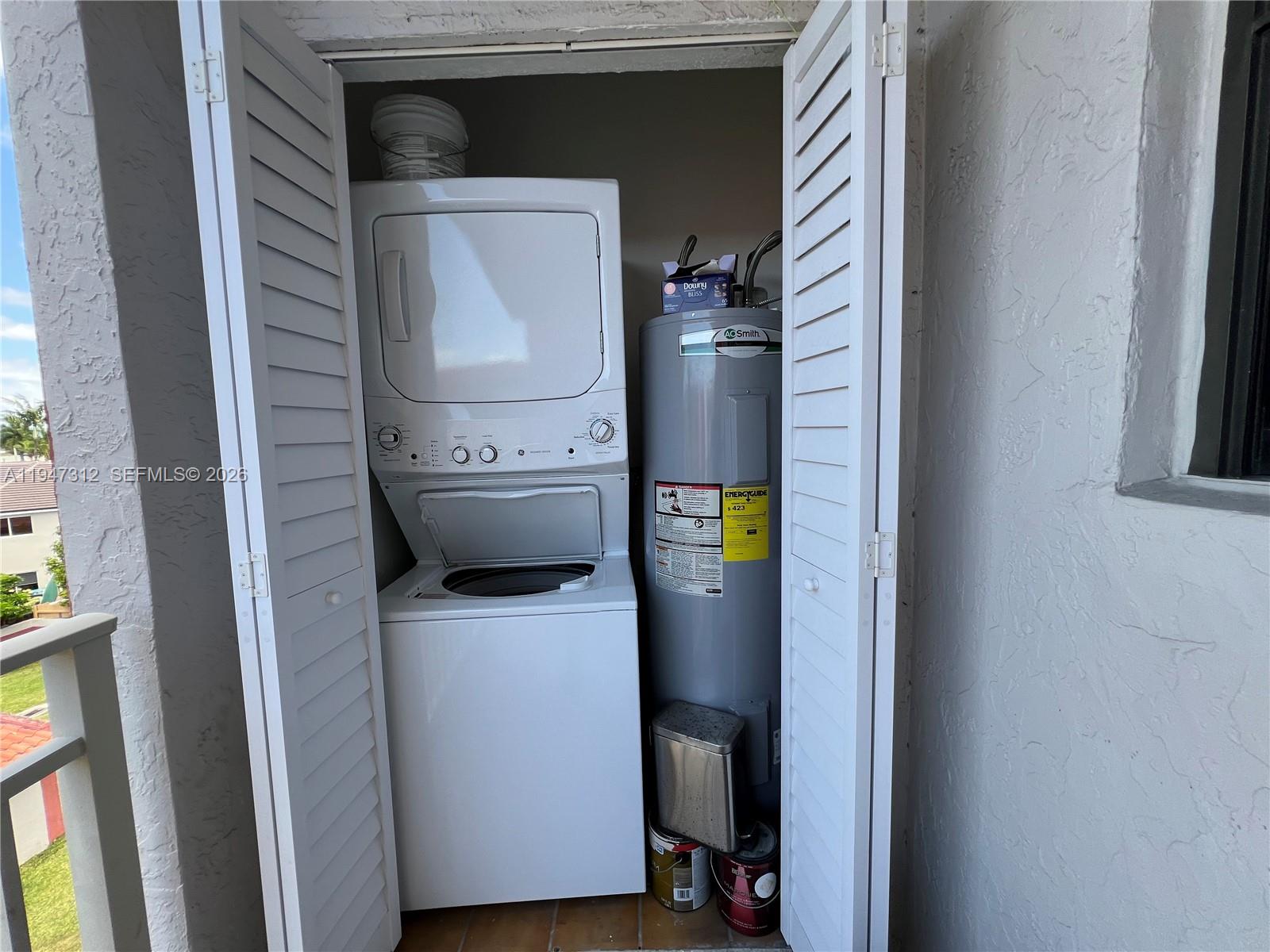 8425 Northwest 8th Street, Unit 406 Miami, FL 33126 - Photo 20 of 22 a utility room with dryer and washer