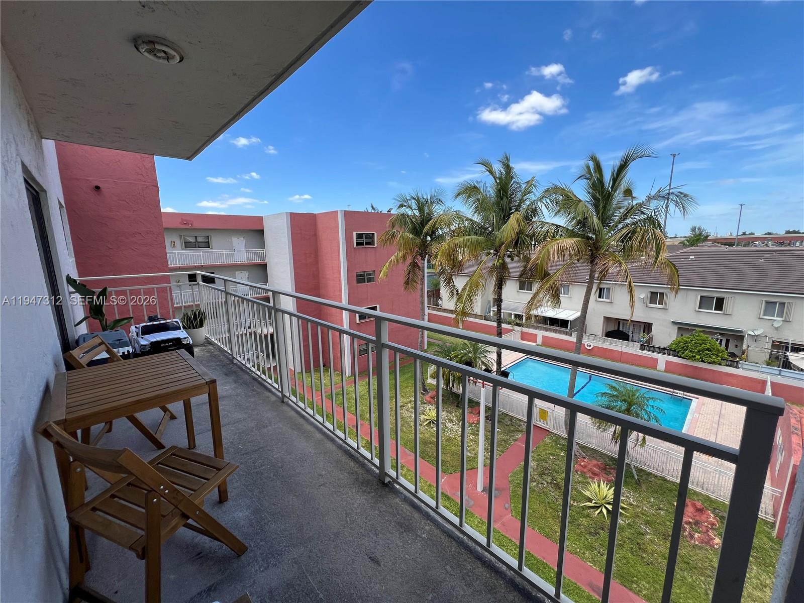 8425 Northwest 8th Street, Unit 406 Miami, FL 33126 - Photo 22 of 22 a view of a balcony