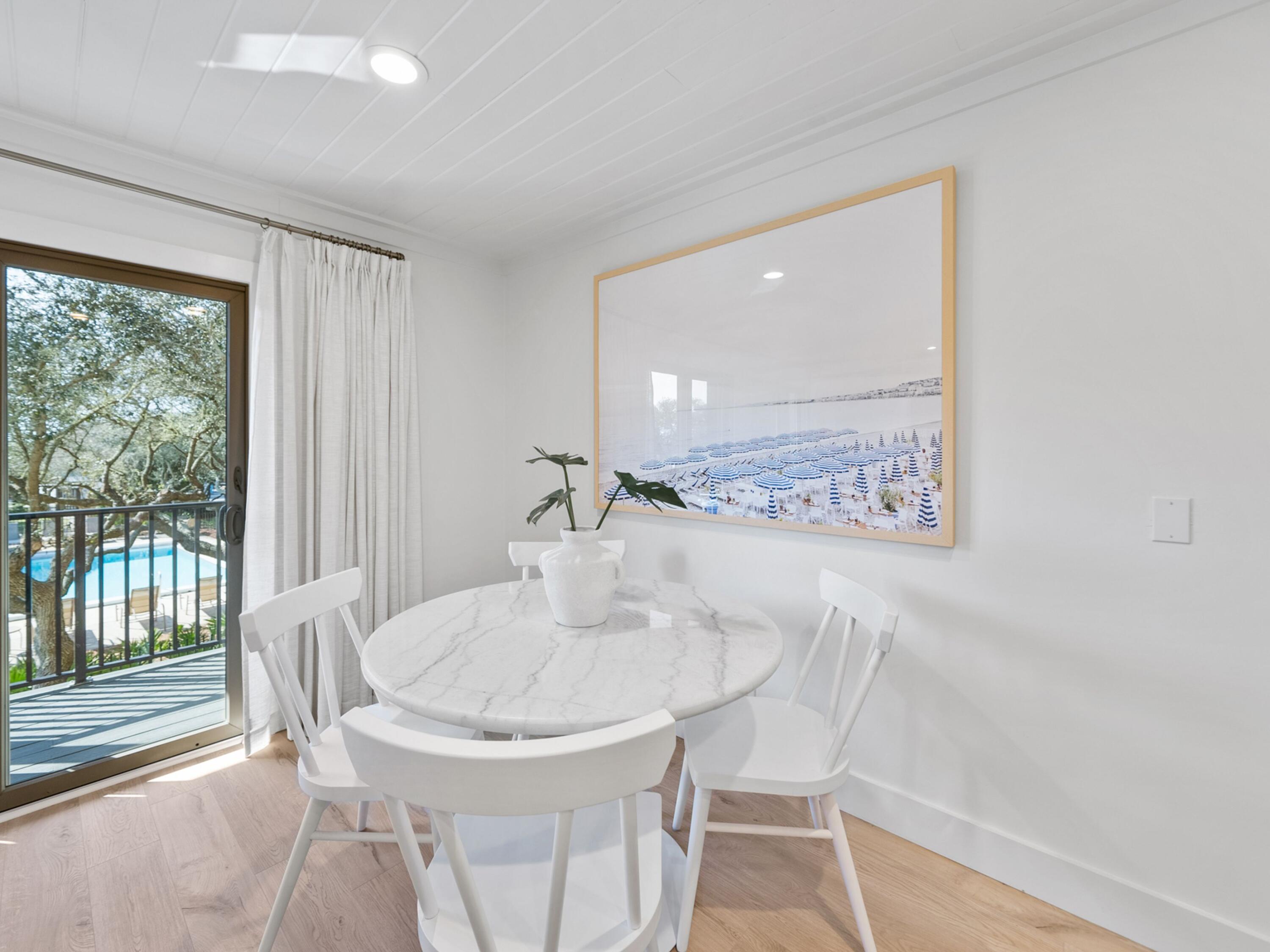81 South Orange Street, Unit 205 Inlet Beach, FL 32461 - Photo 18 of 28 a dining room with furniture and window