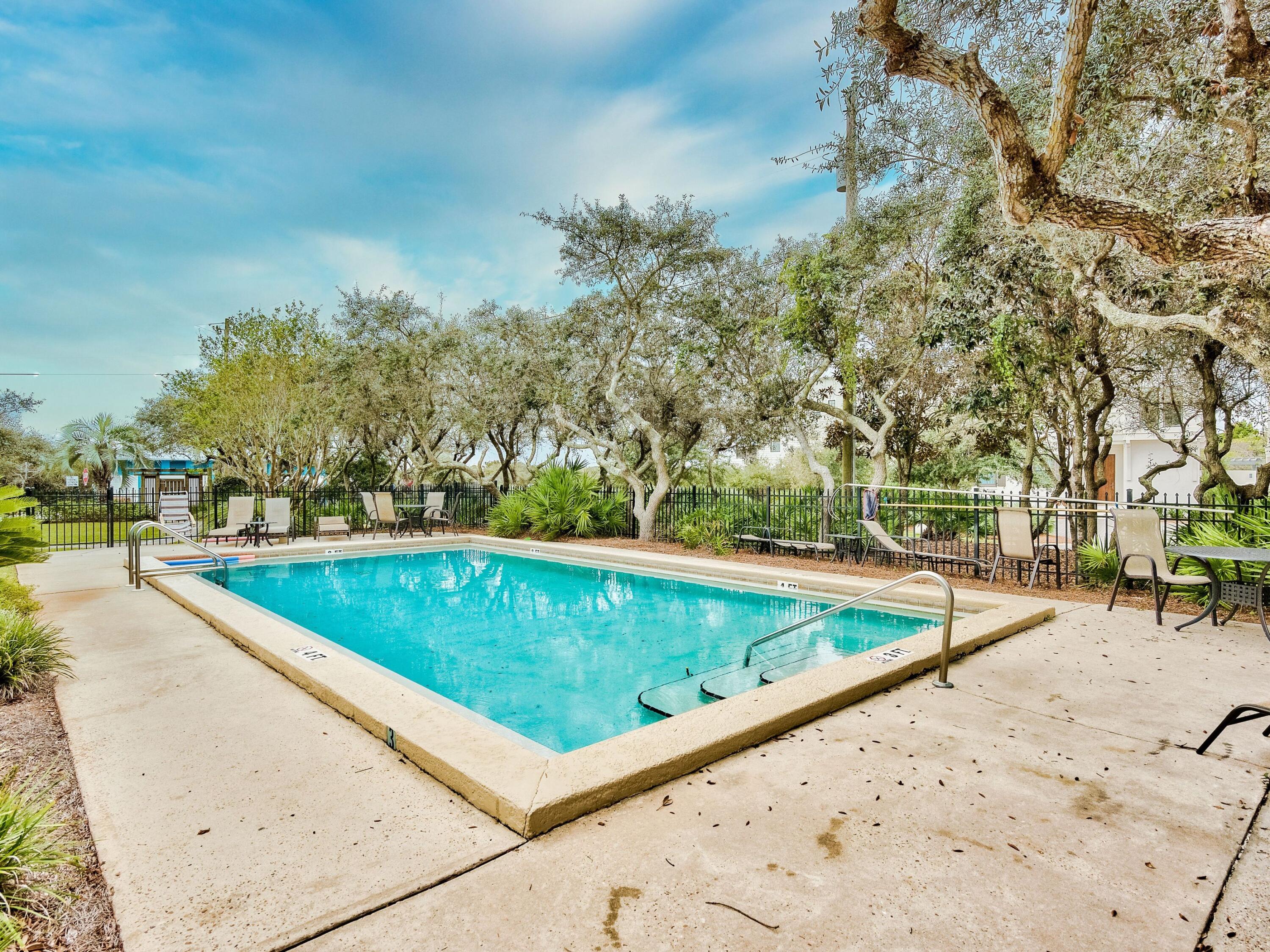 81 South Orange Street, Unit 205 Inlet Beach, FL 32461 - Photo 22 of 28 a view of a swimming pool with a lounge chair