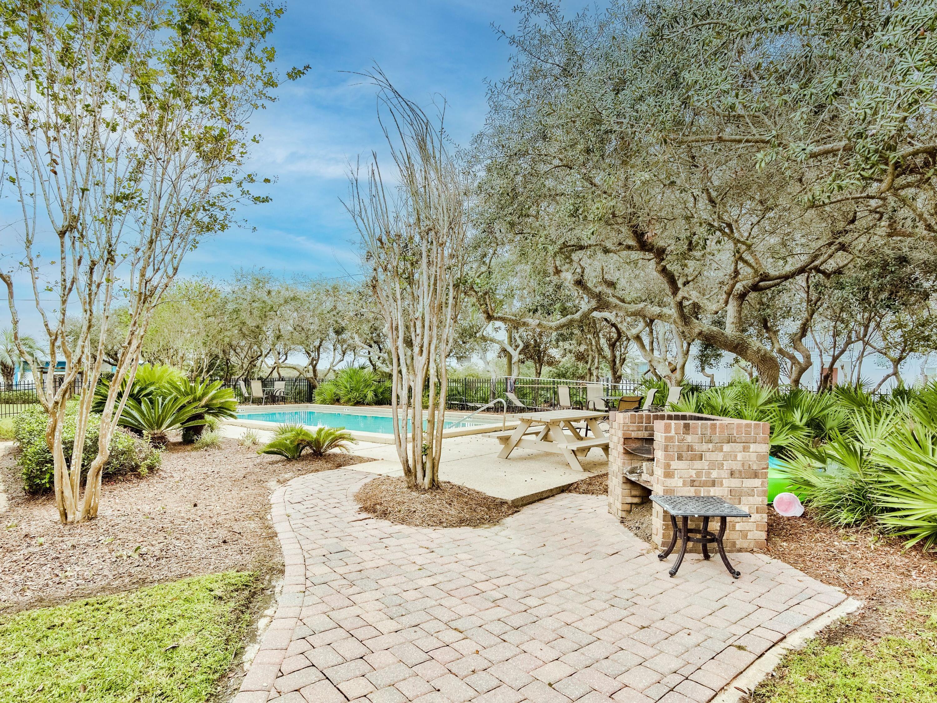 81 South Orange Street, Unit 205 Inlet Beach, FL 32461 - Photo 23 of 28 a view of a park with bench and trees