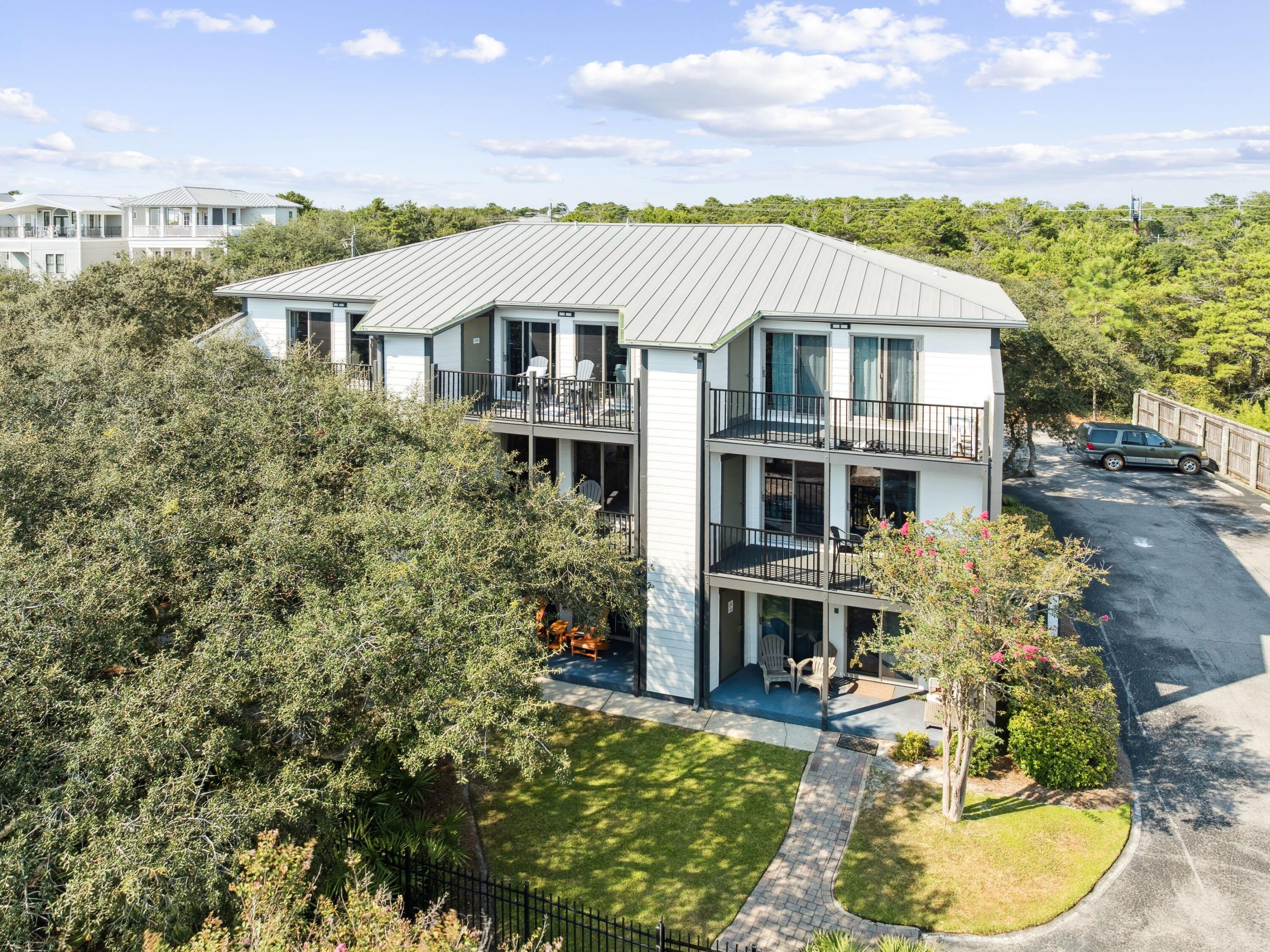 81 South Orange Street, Unit 205 Inlet Beach, FL 32461 - Photo 4 of 28 a aerial view of a house with table and chairs