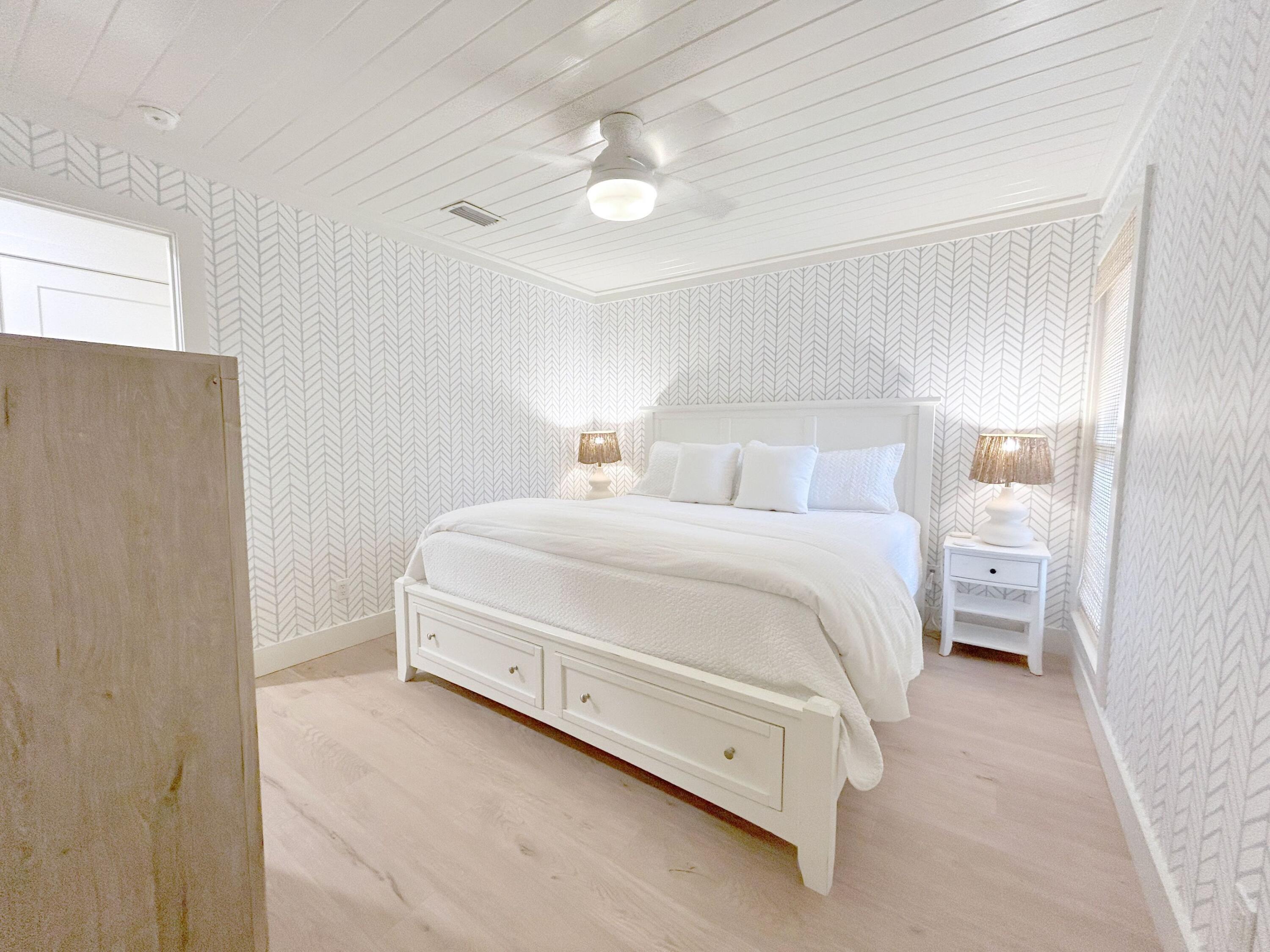 81 South Orange Street, Unit 205 Inlet Beach, FL 32461 - Photo 8 of 28 a room with a bed and a lamp