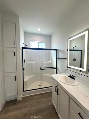 a bathroom with a double vanity sink and mirror