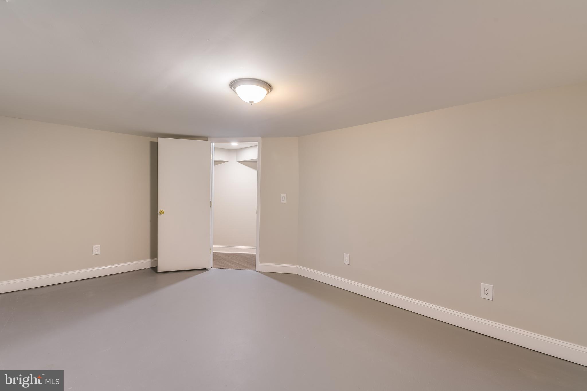 8408 Maryland Road Pasadena, MD 21122 - Photo 39 of 47 LL Finished Space for Playroom. Office. Guests