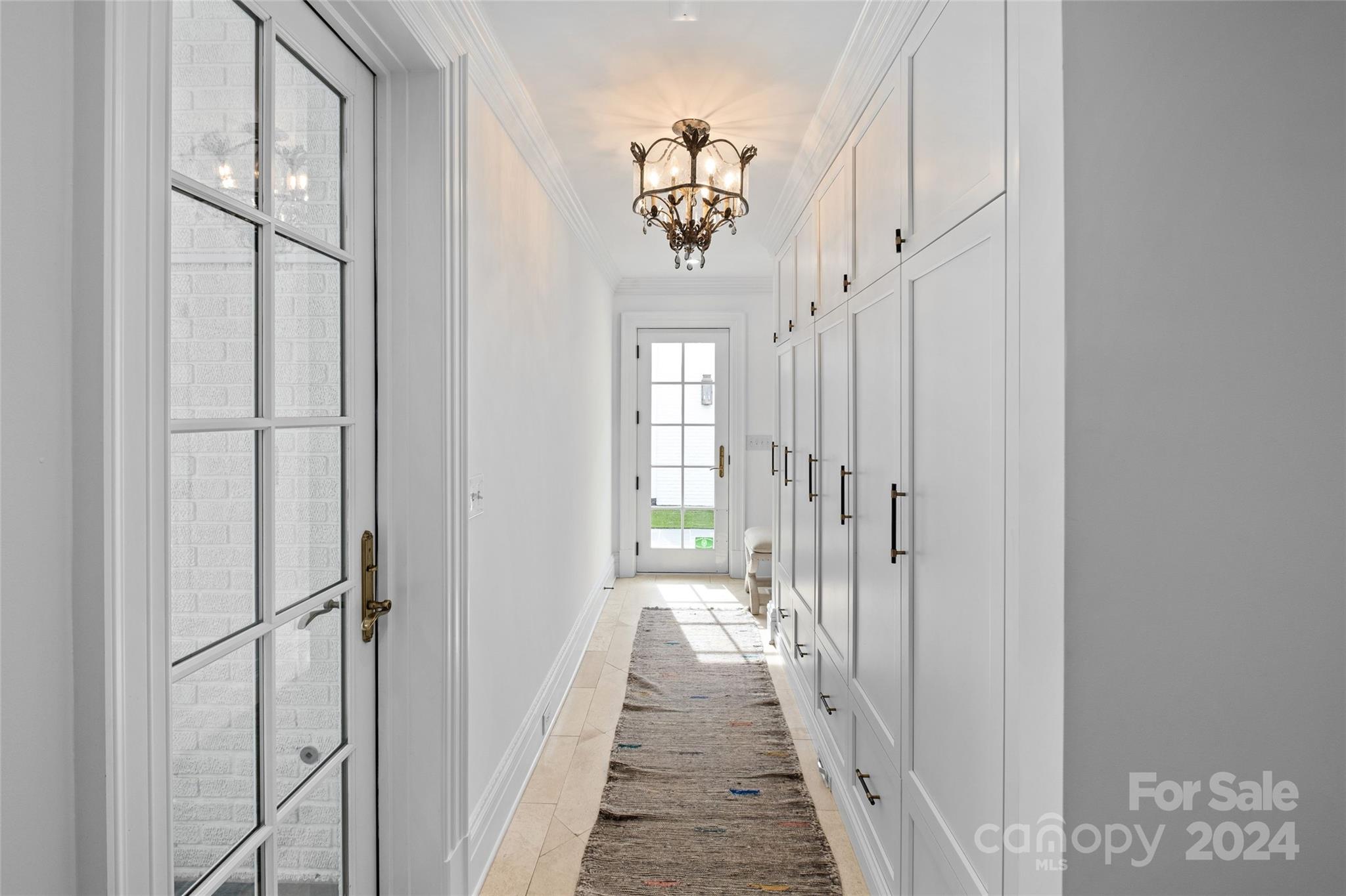 1930 Queens Road West Charlotte, NC 28209 - Photo 11 of 47 a view of a hallway with a chandelier
