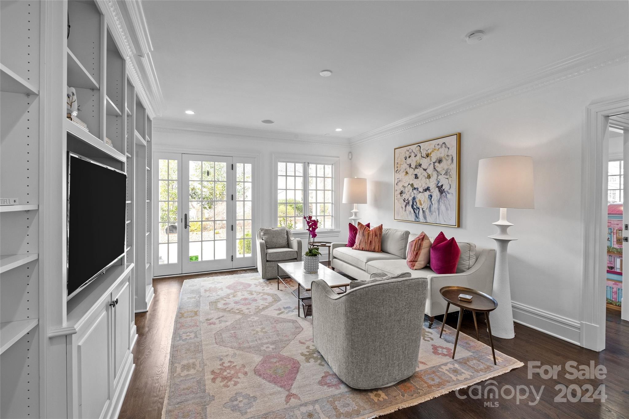1930 Queens Road West Charlotte, NC 28209 - Photo 14 of 47 a living room with furniture a flat screen tv and a refrigerator