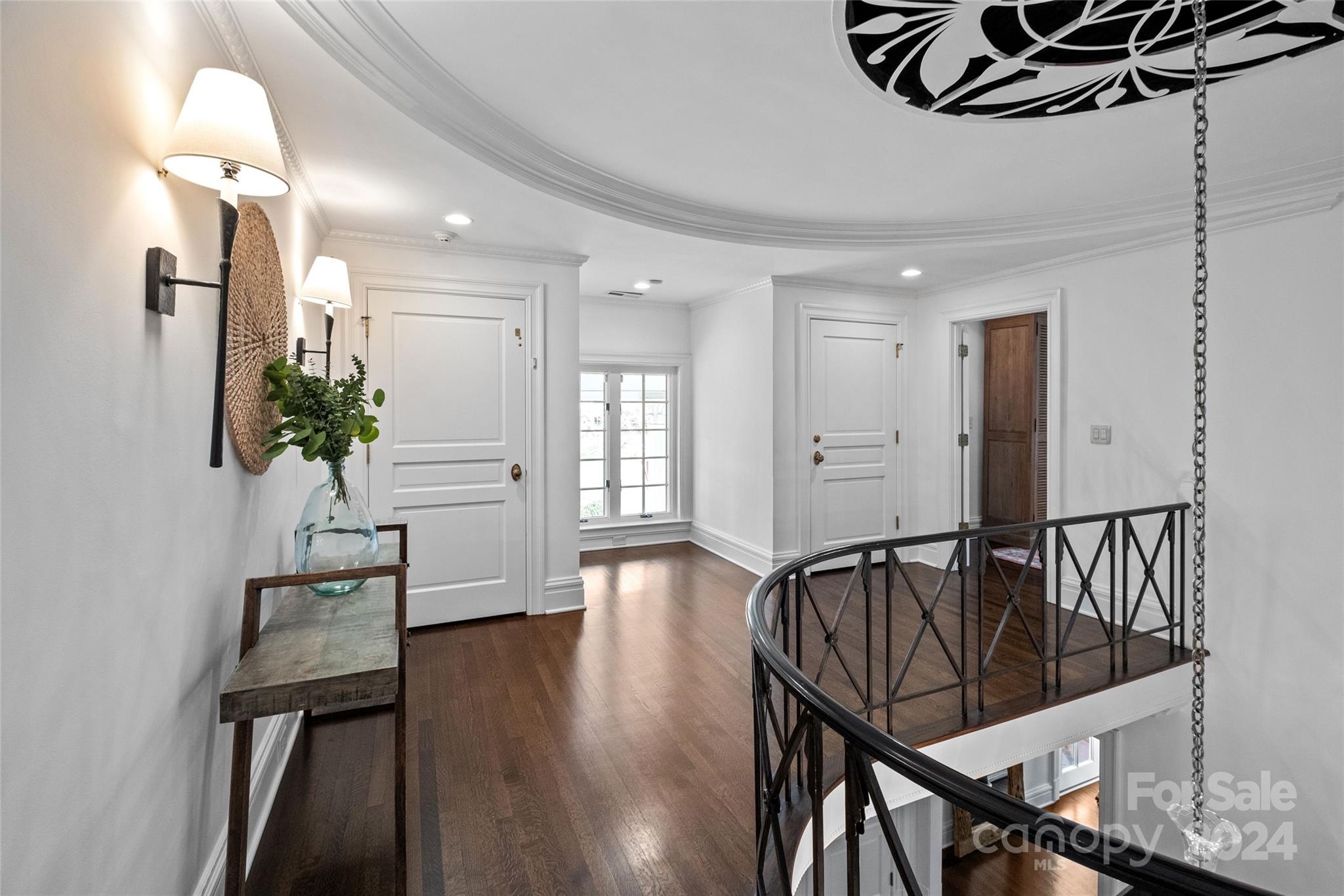 1930 Queens Road West Charlotte, NC 28209 - Photo 18 of 47 a view of a hallway with wooden floor and staircase