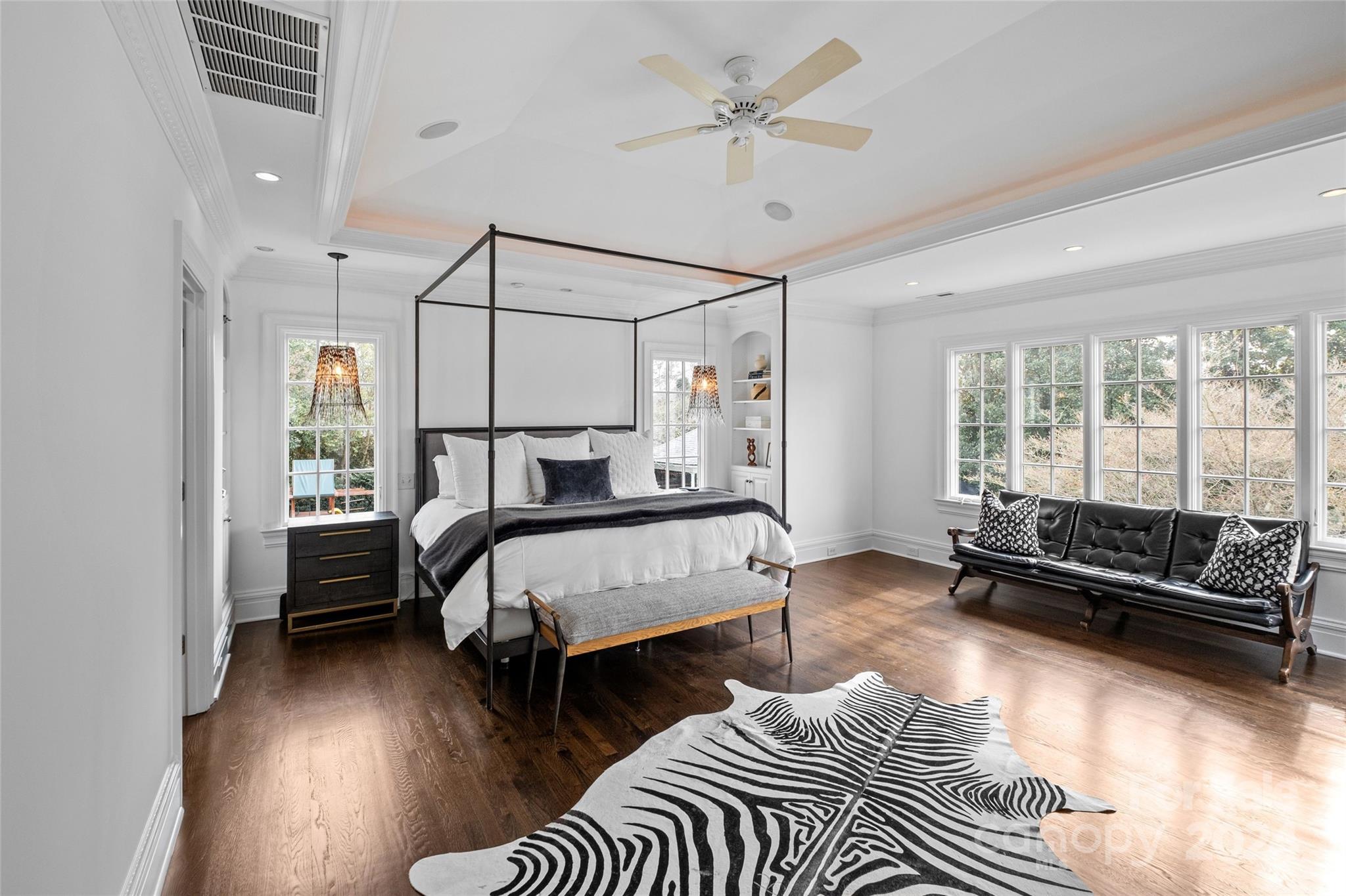 1930 Queens Road West Charlotte, NC 28209 - Photo 19 of 47 a bedroom with a bed couch and a window