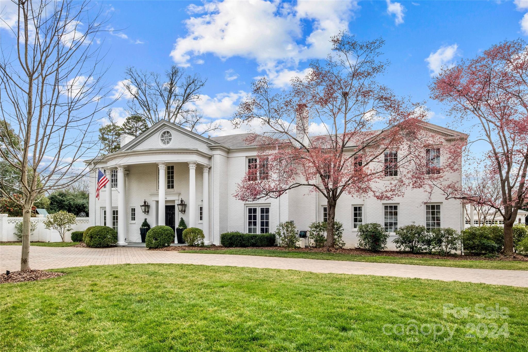 1930 Queens Road West Charlotte, NC 28209 - Photo 2 of 47 a view of a white house with a yard