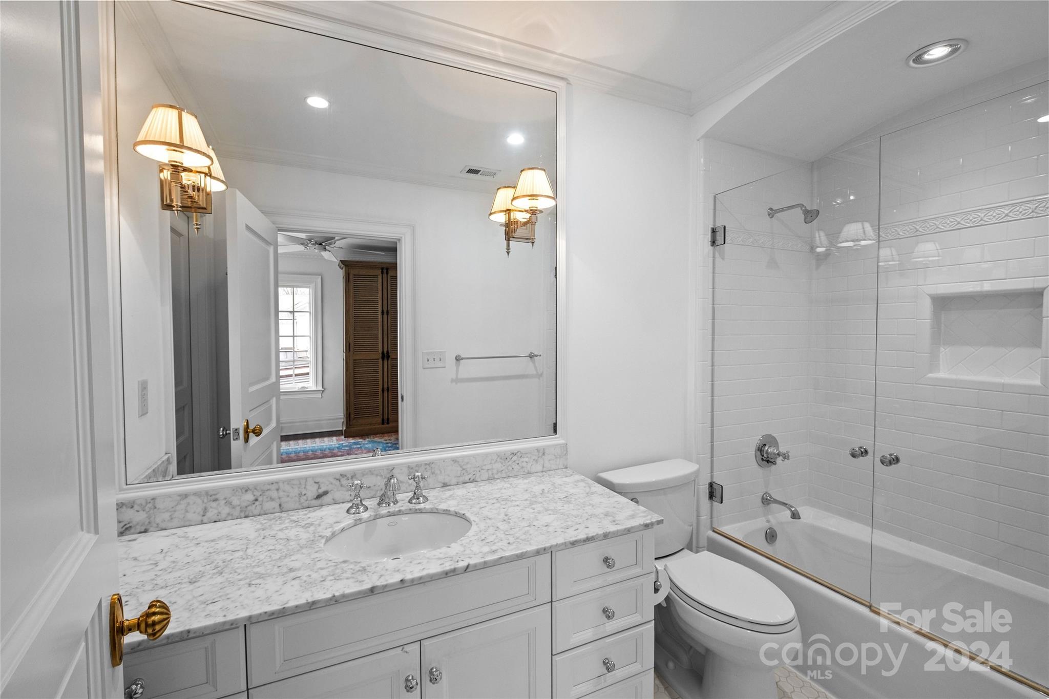 1930 Queens Road West Charlotte, NC 28209 - Photo 22 of 47 a bathroom with a granite countertop sink toilet and shower