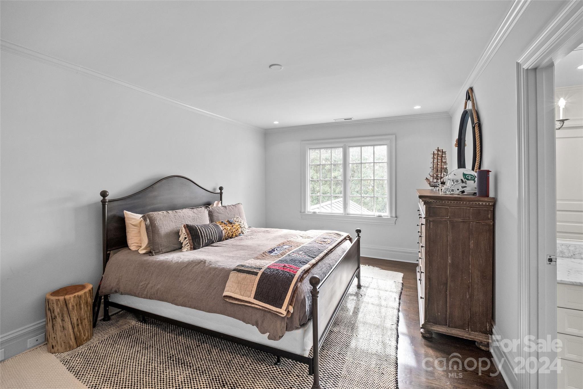1930 Queens Road West Charlotte, NC 28209 - Photo 23 of 47 a bedroom with a bed and wooden floor