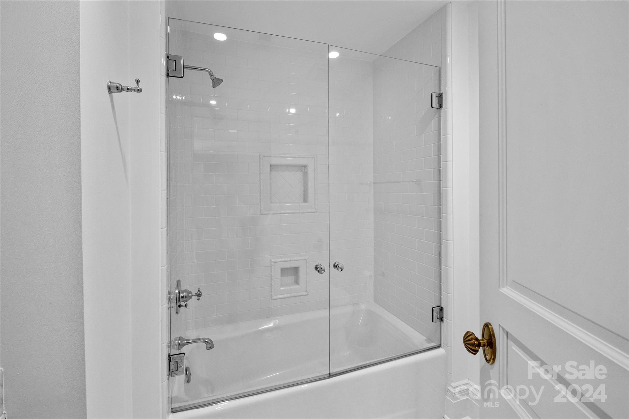 1930 Queens Road West Charlotte, NC 28209 - Photo 26 of 47 a white bath tub sitting next to a shower