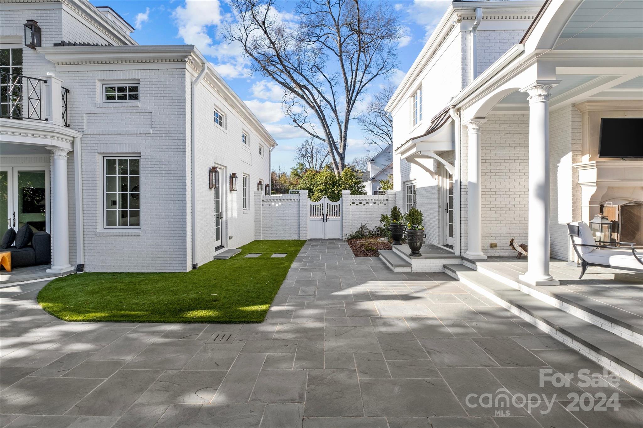 1930 Queens Road West Charlotte, NC 28209 - Photo 29 of 47 a view of a house with a patio