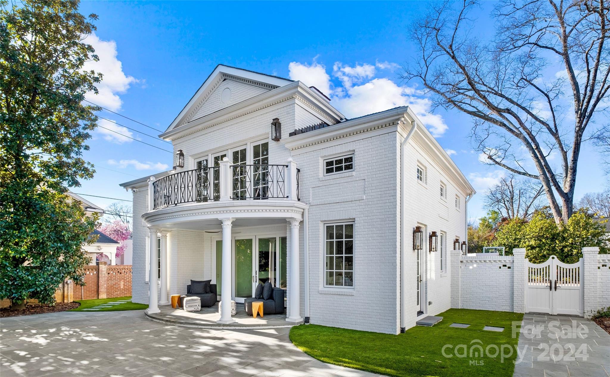 1930 Queens Road West Charlotte, NC 28209 - Photo 37 of 47 a front view of a house with a yard