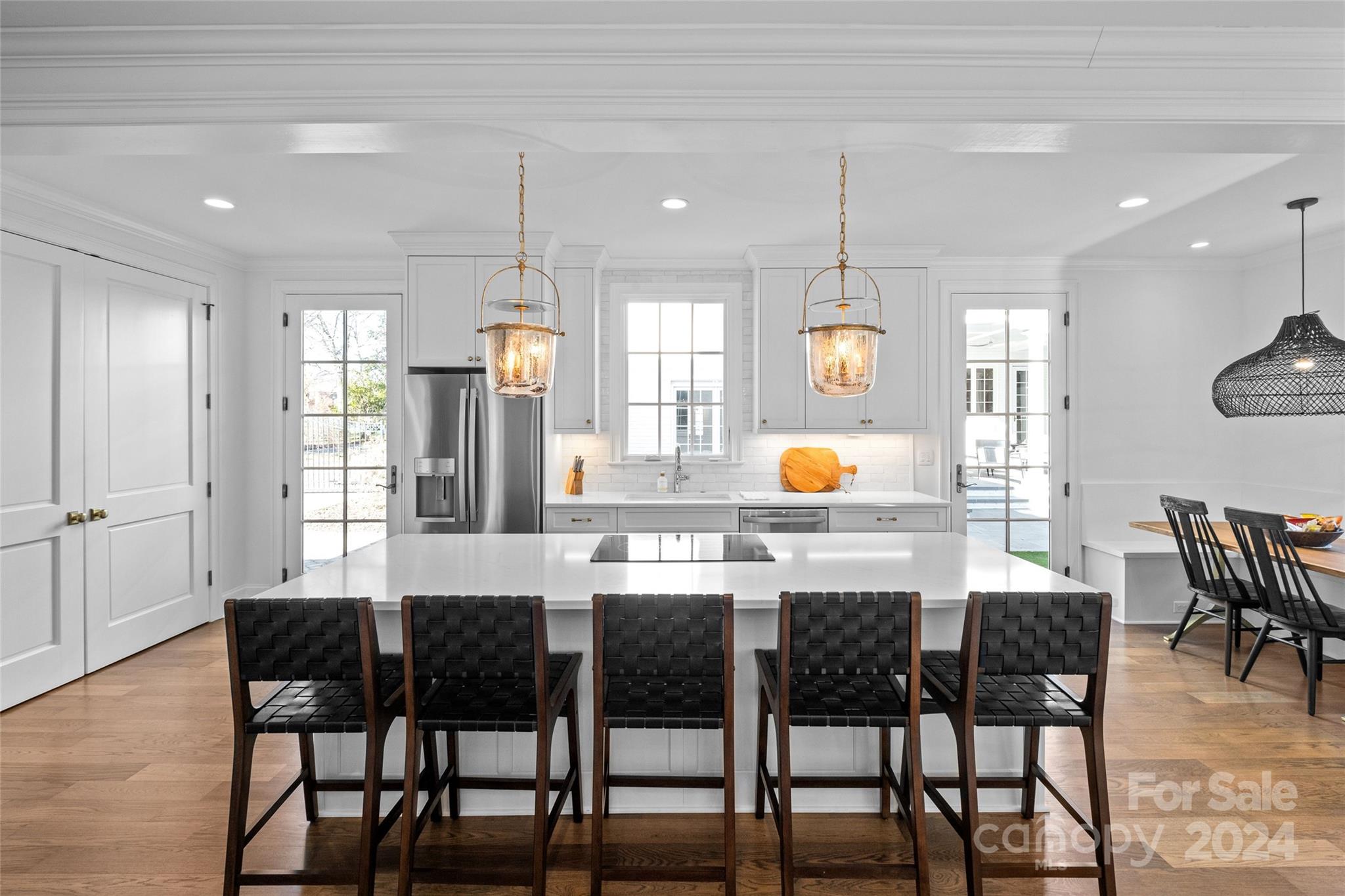 1930 Queens Road West Charlotte, NC 28209 - Photo 38 of 47 a kitchen with cabinets dining table and chairs