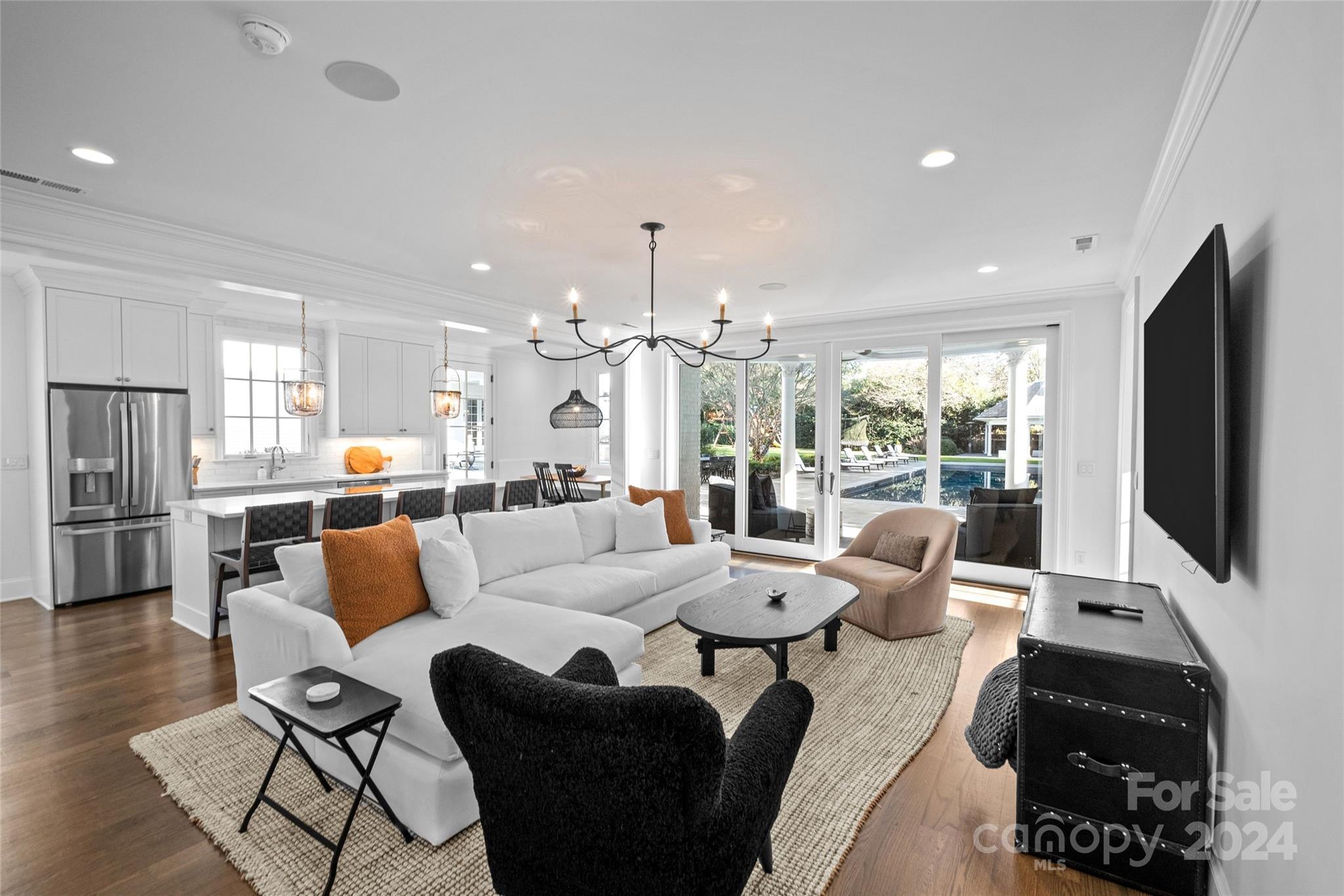 1930 Queens Road West Charlotte, NC 28209 - Photo 41 of 47 a living room with furniture flat screen tv and large windows