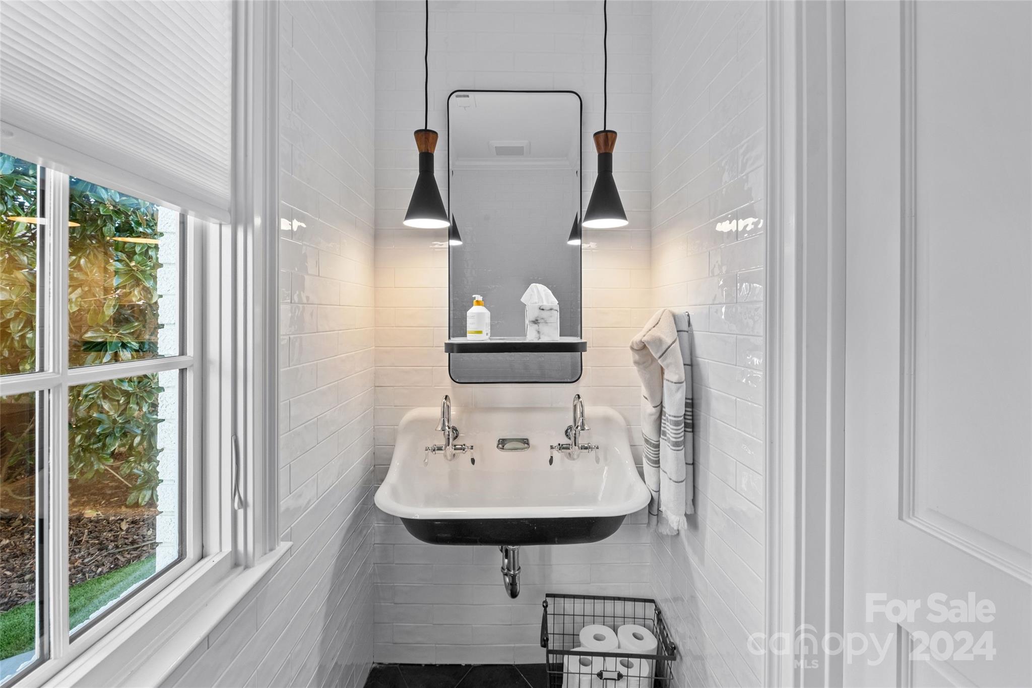 1930 Queens Road West Charlotte, NC 28209 - Photo 44 of 47 a view of a bathroom with a sink and mirror