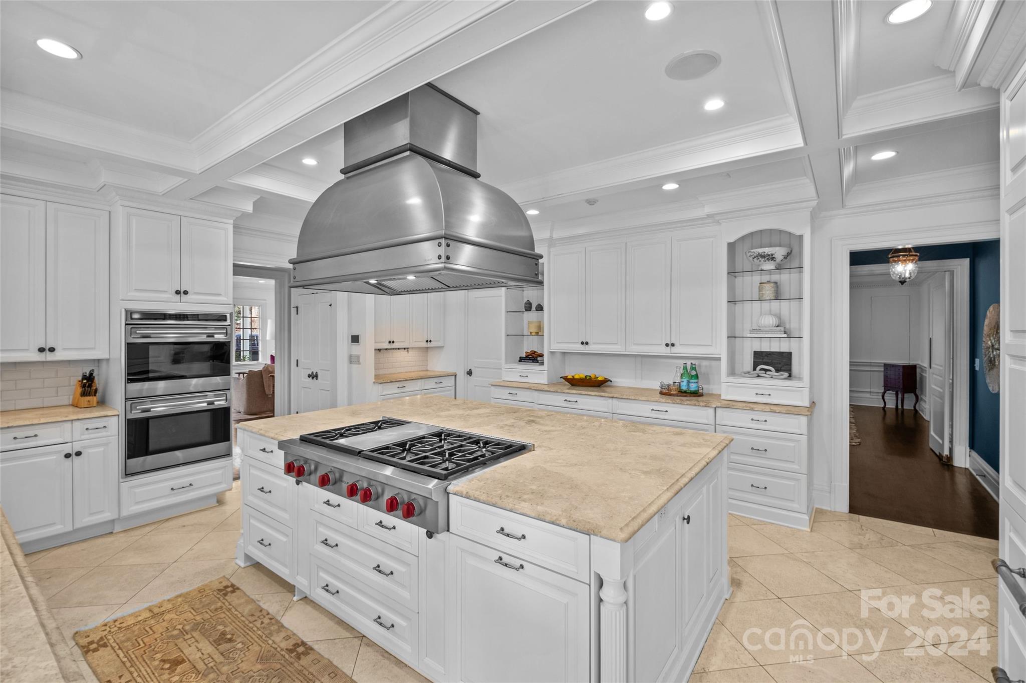 1930 Queens Road West Charlotte, NC 28209 - Photo 10 of 47 a kitchen with a stove a sink and a refrigerator