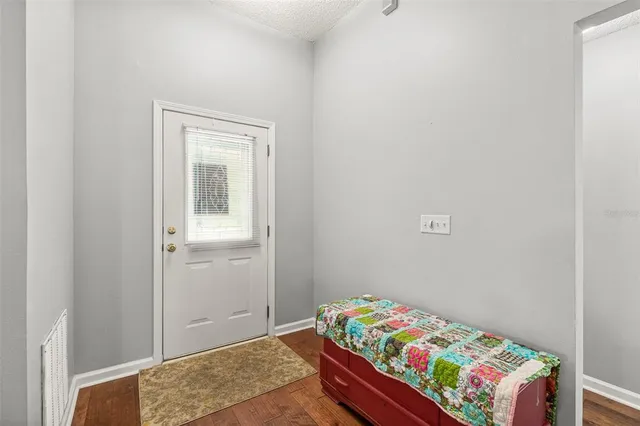 a view of a dining room with furniture and a chandelier