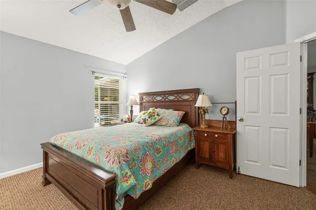 a bedroom with a bed and a dresser in it