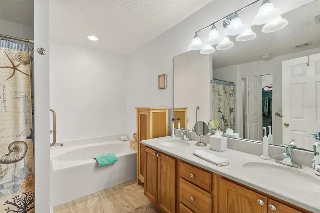 a bathroom with a bathtub and shower