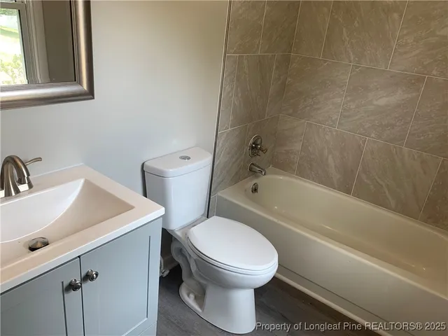 a bathroom with a toilet sink and bathtub