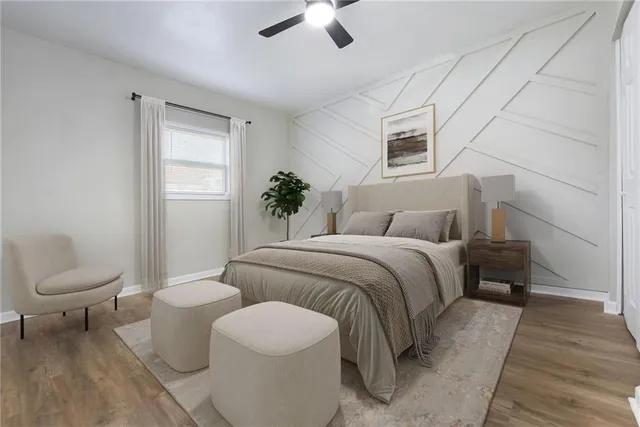 a spacious bedroom with a bed and a couch