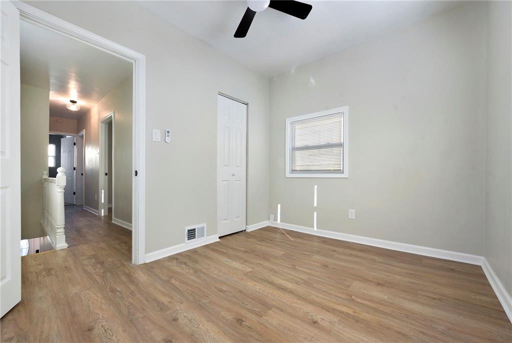 440 Ruxton Street Pittsburgh, PA 15211 - Photo 18 of 37 wooden floor in an empty room with a window