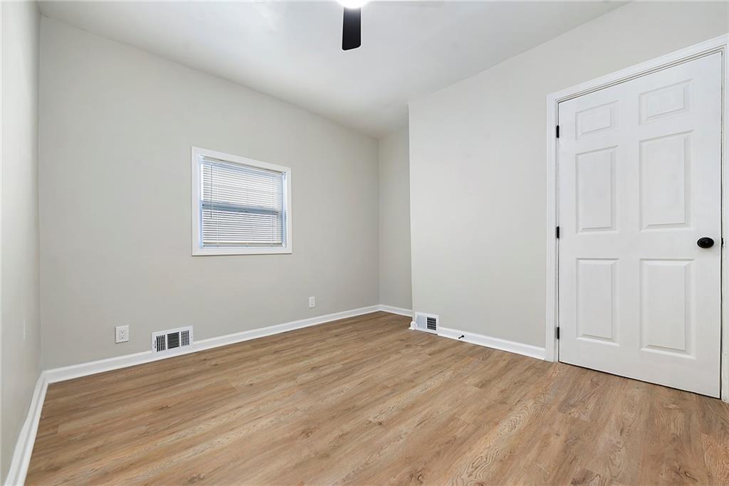 440 Ruxton Street Pittsburgh, PA 15211 - Photo 19 of 37 an empty room with wooden floor and windows