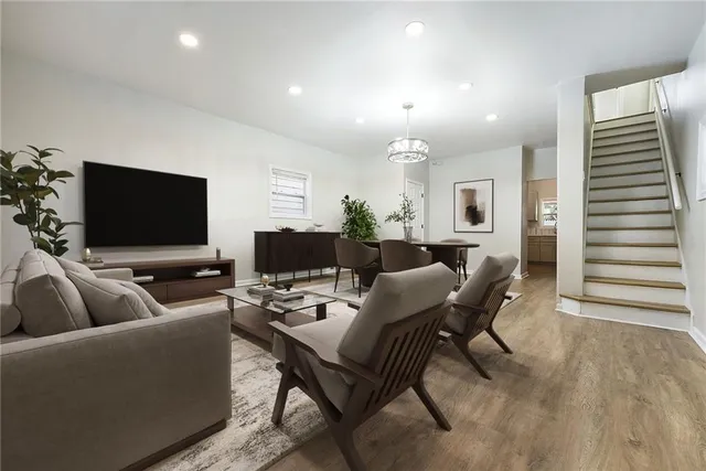 a living room with furniture and a flat screen tv