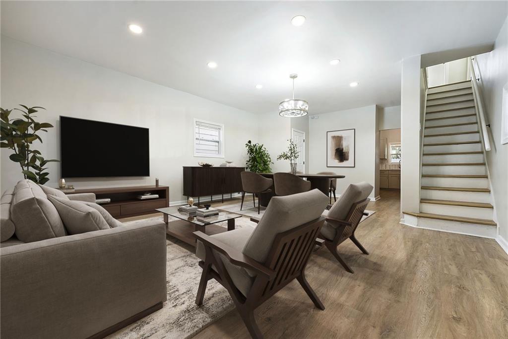 440 Ruxton Street Pittsburgh, PA 15211 - Photo 2 of 37 a living room with furniture and a flat screen tv