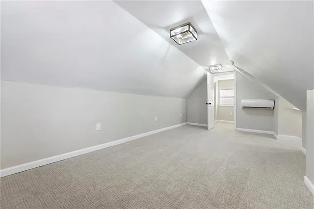 a view of a big room with stairs and a living room