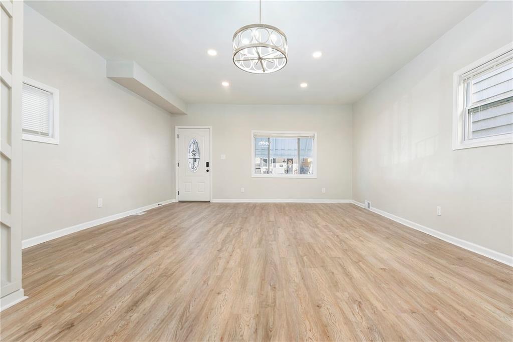 440 Ruxton Street Pittsburgh, PA 15211 - Photo 36 of 37 wooden floor in an empty room with a window