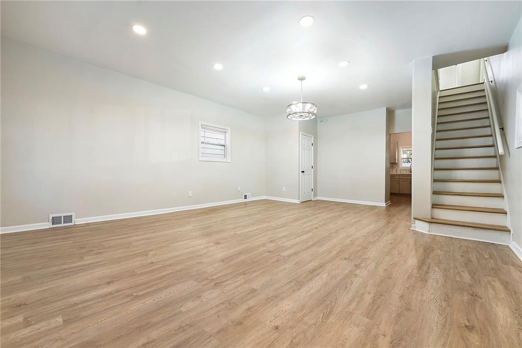 440 Ruxton Street Pittsburgh, PA 15211 - Photo 4 of 37 an empty room with wooden floor and window