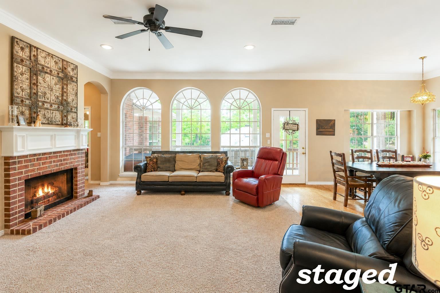 1388 Santa Fe Trail Tyler, TX 75703 - Photo 23 of 46 a living room with furniture a fireplace a large window and a fireplace