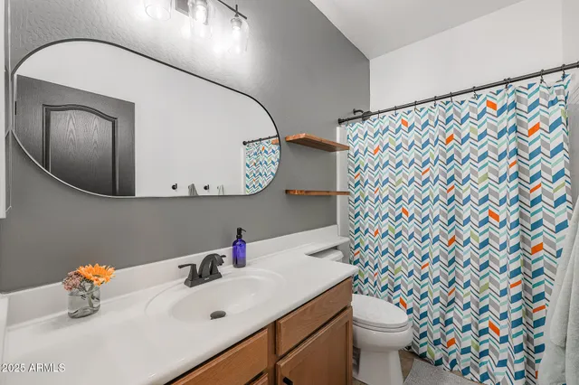 a bed room with a bed and a desk