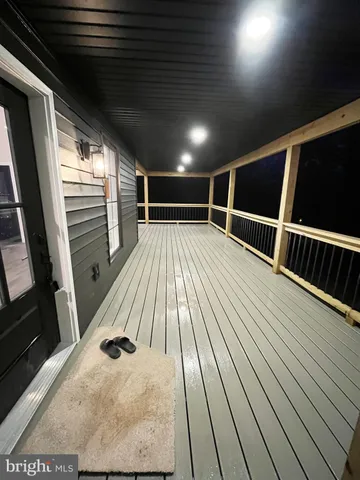 a view of balcony with wooden floor