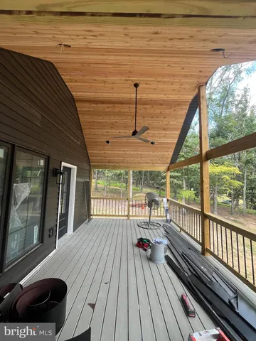 a view of balcony with wooden floor
