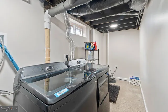 a kitchen with a sink a stove and a microwave