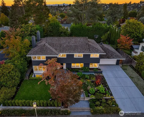 a aerial view of a house with a yard