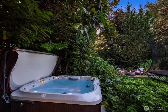 a view of a backyard with plants and trees