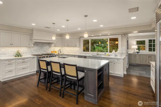 a kitchen with granite countertop kitchen island wooden cabinets and center island