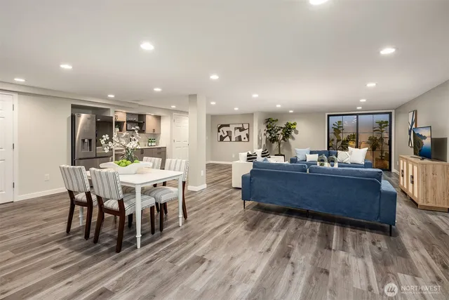 a view of a dining room with furniture wooden floor and chandelier