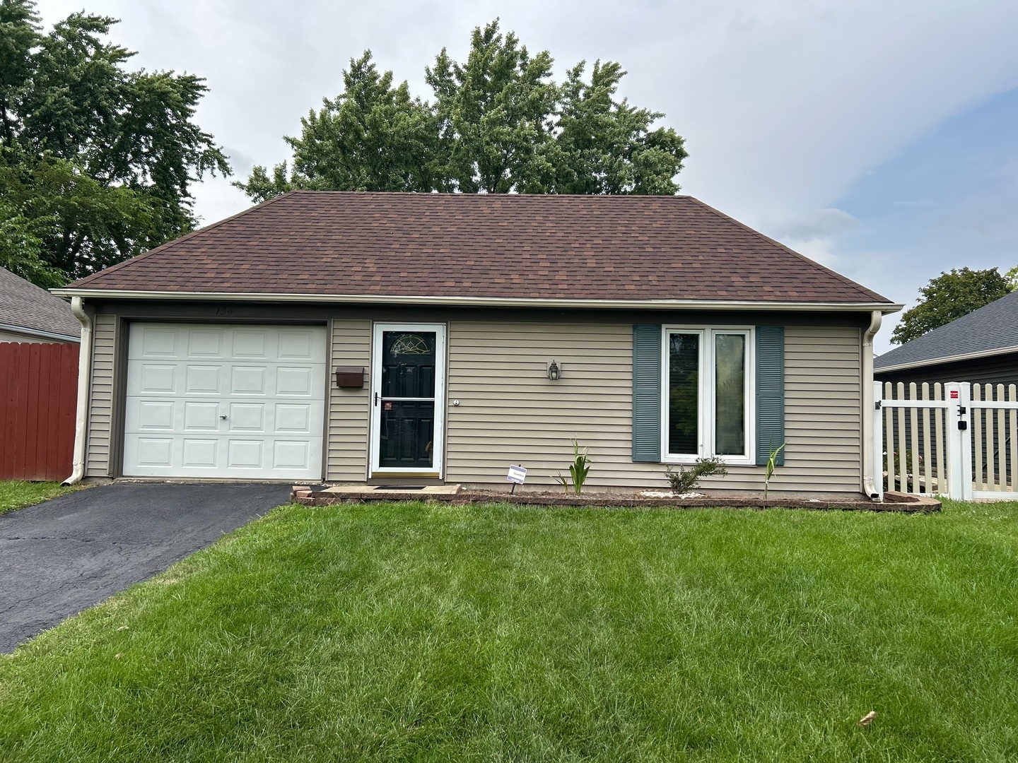 136 Heathgate Road Montgomery, IL 60538 - Photo 1 of 26 a house view with a garden space