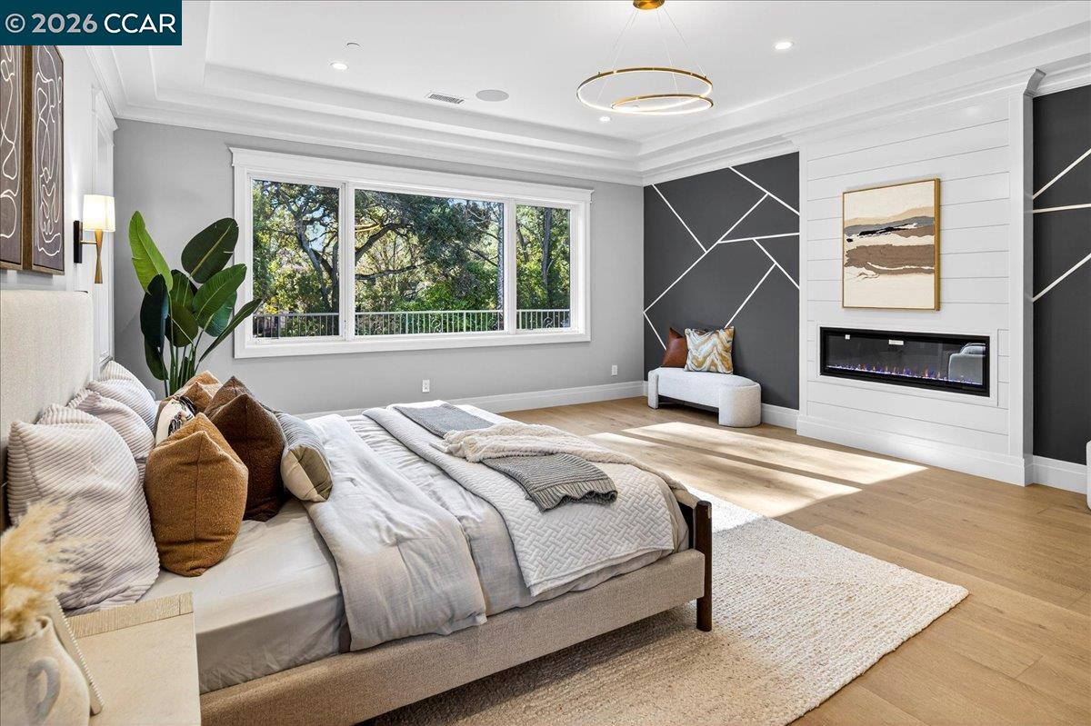 74 Middlefield Road Atherton, CA 94027 - Photo 28 of 49 a bedroom with a bed and wooden floor