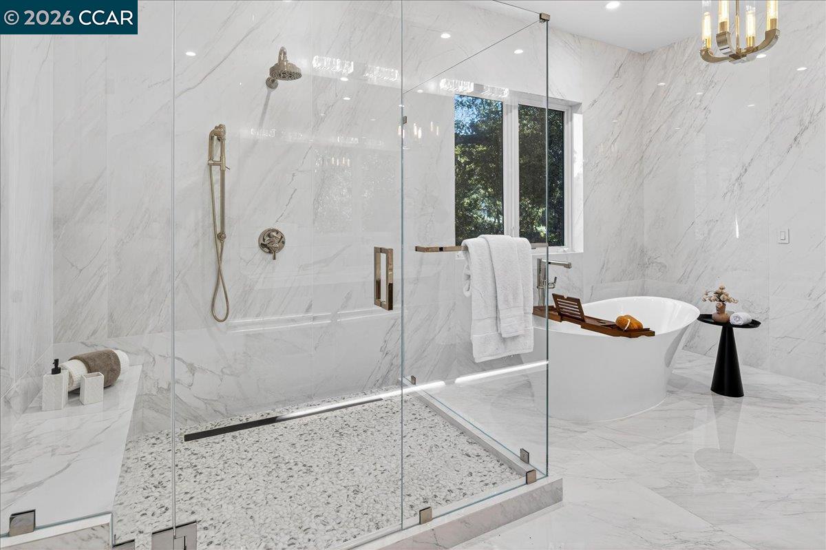 74 Middlefield Road Atherton, CA 94027 - Photo 31 of 49 a bathroom with a tub sink and glass door shower